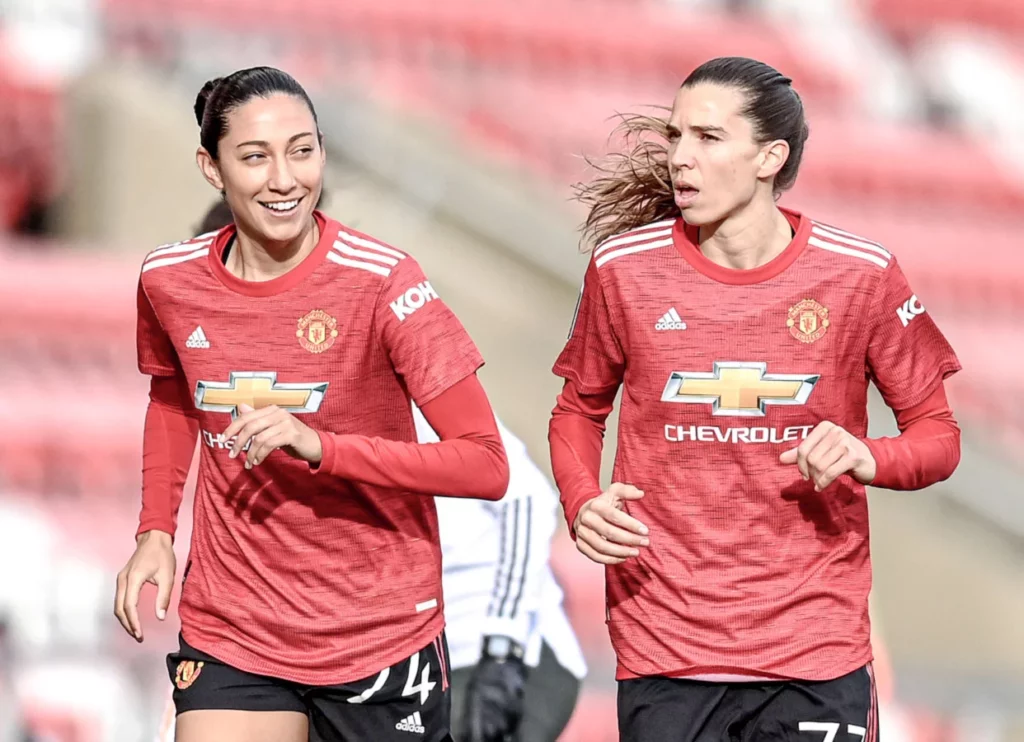 Christen Press (en la izquierda) y Tobin Heath, jugadoras del United de Stoney en la temporada 2020/21